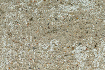 The image captures a detailed sandy surface with diverse particles, showcasing the unique natural composition of sand and earth, reflecting the beauty of our environment