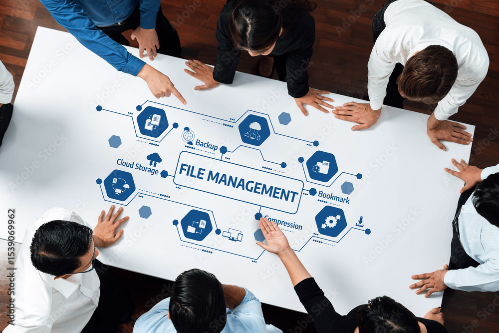 Poster A diverse team collaborates around a table, strategizing file management solutions. Highlighting cloud storage, backup, and data organization for improved workflow and productivity. Amity