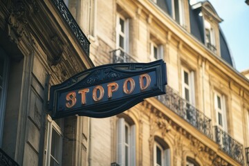 Obraz premium Vertical signboard for a Paris hostel against a beautiful historic building facade in the heart of the city, Paris hostel vertical signboard on a building facade in beautiful city center