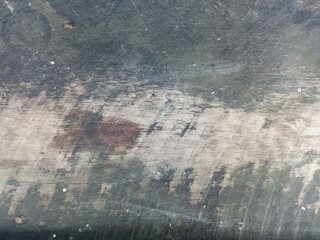Dark Weathered Surface with Faded Circular Detail