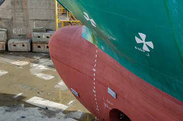 The view at the front part of the ship where the bulb, two bow thrusters and a draught mark are...