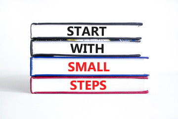 Start with small steps symbol. Concept words phrase Start with small steps on beautiful books....