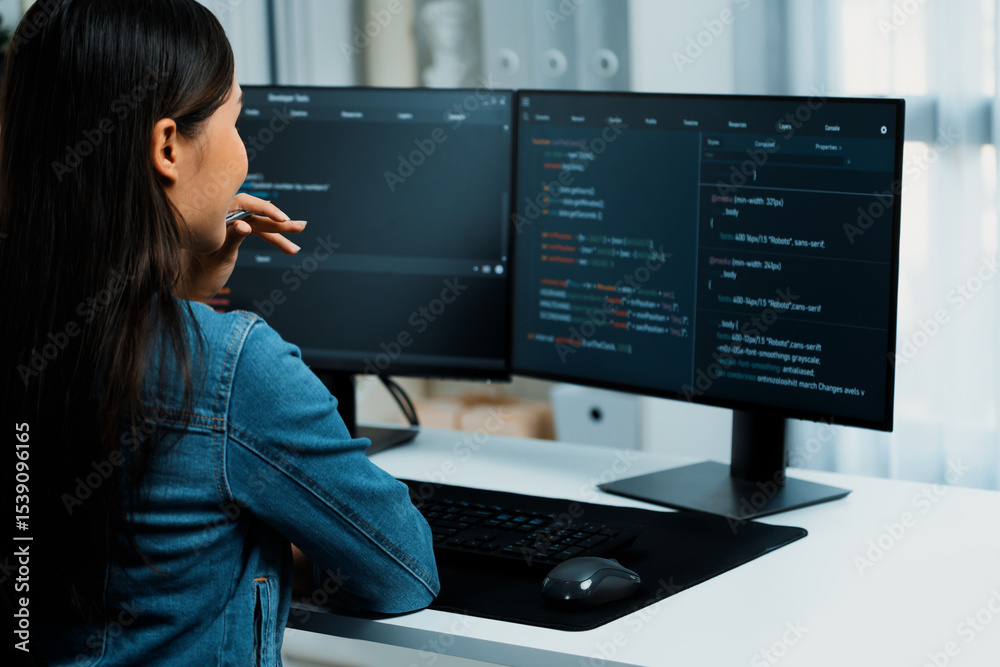 Poster young asian it developer looking online information on pc for beautiful pose with coding program dat