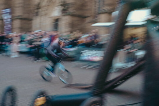 Blurred cyclist in motion during fast street performance - Powered by Adobe