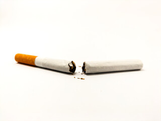 broken cigarette on light background