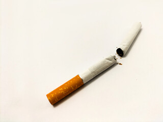 broken cigarette on light background