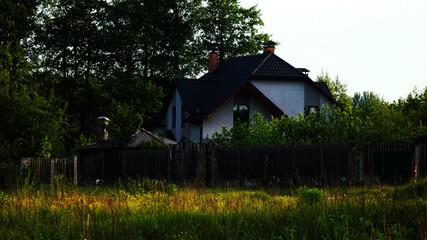 The house is in the woods