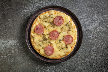 Small personal pizza. Calabrian sausage pizza.