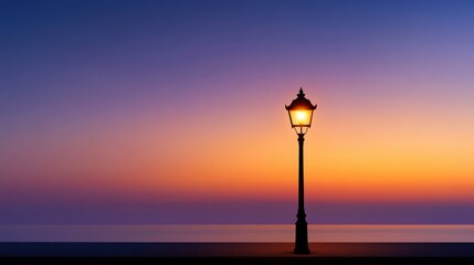 A tranquil sunset casts vibrant hues across the sky and reflects on the still water. A lone streetlamp illuminates the scene with a cozy light, creating a peaceful atmosphere