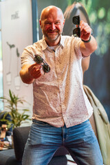 Happy man with bald head and sun glasses at shop 