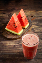 Delicious fresh watermelon juice in glass cup with sliced ​​watermelons.
