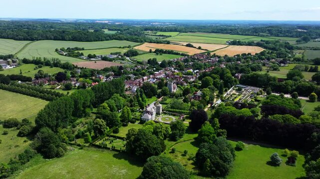 Aerial shot flying over the Wiltshire town of Cranbourne in Summer