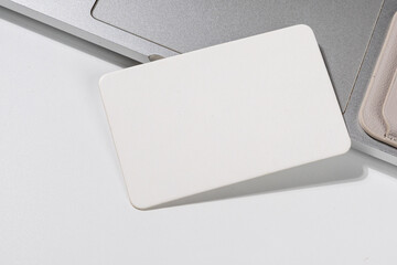 Simple White Card and Leather Holder on Clean Background – Brand Display