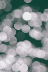 Water surface top view. Blurred defocus with bokeh effect. Sun glare on water. Background...