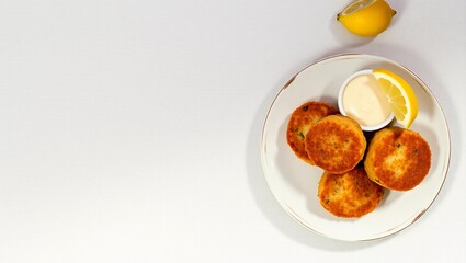 copy space crispy texture tartar sauce clam cakes seafood appetizer golden brown top-down food coastal cuisine
