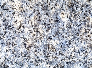 Close-up of a polished marble stone surface with intricate veins and patterns