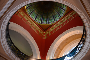 Elegant architecture with a stunning stained glass dome and intricate arches