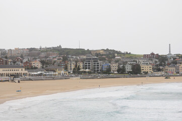 Serene Bondi Beach and architecture under cloudy sky, Australia