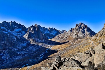 Dramatic peaks and alpine valleys of Nyenpo Yutse Geological Park in Amdo, Tibet, showcasing rugged terrain and pristine highland wilderness.