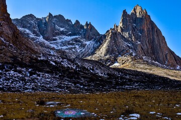 Dramatic peaks and rocky cliffs at Nyenpo Yutse (Lianbao Yeze) Geological Park in Amdo, Tibet, showcasing the raw alpine beauty and rugged terrain of the Greater Tibet region.