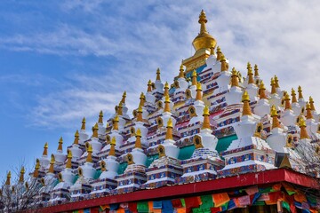 Colorful Tibetan stupas at Vache (Waqie) in Zoigê Marsh, showcasing traditional Buddhist architecture in the Amdo region of Greater Tibet.
