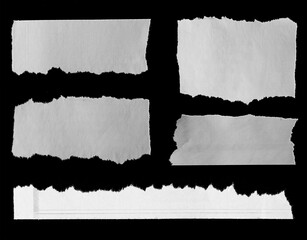 Torn papers on black