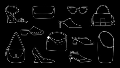 This stylish collection of shoes and accessories on a black background. A great choice for creating attractive visual content.