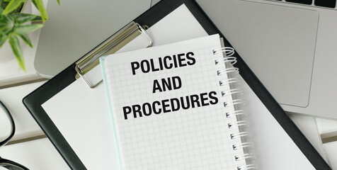 A notebook with the words policies and procedures written on it
