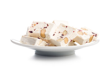 White nougat bars with almonds and dried fruit isolated on white background.