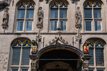 Fototapeta premium Old Town Hall of Gouda (Stadhuis van Gouda, 1448 - 1450), it is one of oldest Gothic city halls in the Netherlands. Architectural fragments of the façade. Gouda, the Netherlands.