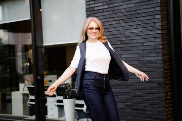 Smiling woman spinning joyfully in business casual outfit