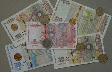 Bulgarian leva banknotes and coins arranged on neutral background. Bulgarian Levs. Bulgarian National Currency. Bulgarian National Bank