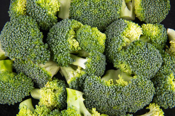 Fresh raw broccoli as background, top view