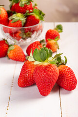Jar with strawberries, a beautiful glass jar full of delicious strawberries on rustic wood, selective focus.