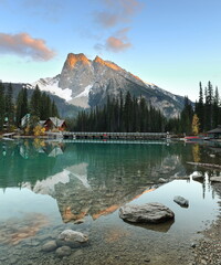 Metallic reflection in Emerald Lake southwest end at evening, the Emerald Lodge peninsula bridge...
