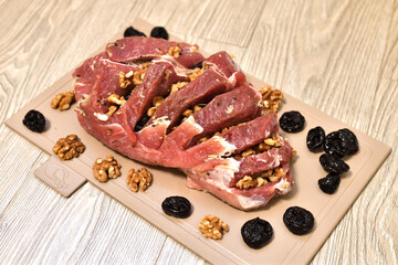 Raw Pork stuffed with walnuts and prunes