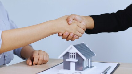 Real men in suits finalize a business agreement with a firm handshake, symbolizing partnership and success