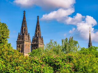 Majestic Gothic Cathedral. Twin Spires Against a Bright Sky. A Beautiful Blend of History and Nature, Perfect for Capturing the Essence of Architectural Grandeur and Cultural Heritage. Stock Photo