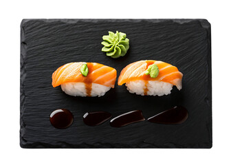 Delicious salmon nigiri sushi on black slate plate