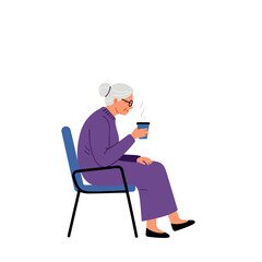 Fototapeta premium Elderly woman drinking coffee alone while sitting in chair 