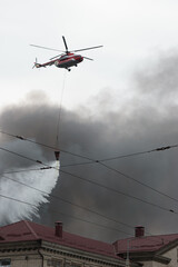 Another sleepless night in Kyiv. Helicopter extinguishes fire in city. The aftermath of russian drone and missile strikes on residential areas of the city