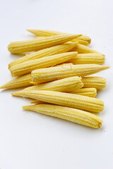 Fresh baby corn on white background.
