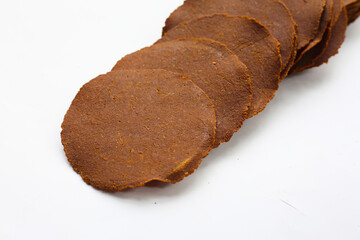 Fermented soybean discs, known as “Thua Nao,” a traditional Thai seasoning used to enhance flavor in Northern cuisine.