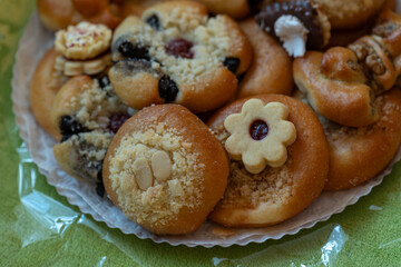 Top view of an open gift tray with wedding pastries and sweets. 
