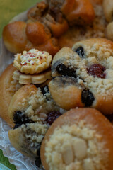 A detailed view of the top part of pastries and sweets side by side.
