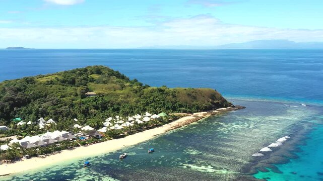 Tokoriki island in Fiji Pacific ocean coral reef remote resort aerial panorama as 4k.
