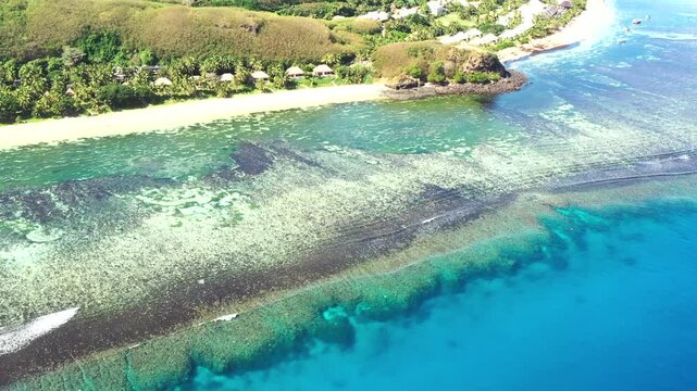 Reefs to blue sky vertical panorama of Tokoriki island resort in Fiji &ndash; pacific paradise.
