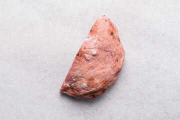 Overhead view of strawberry and chocolate sourdough on a white countertop, top view of pink and...
