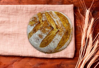 Freshly baked artisan sourdough bread on a wooden board.