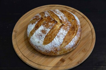 Freshly baked artisan sourdough bread on a wooden board.